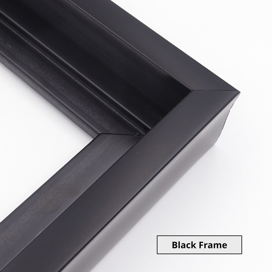 Close-up of the corner of a black picture frame on a white background