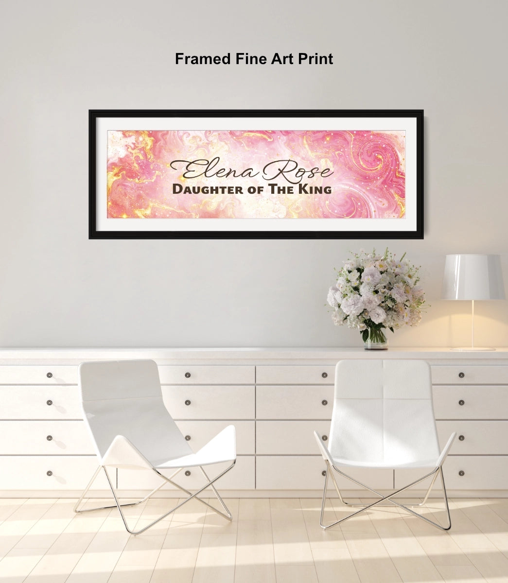 Personalized wall art with a black frame above a white dresser with a pink and white flower arrangement.
