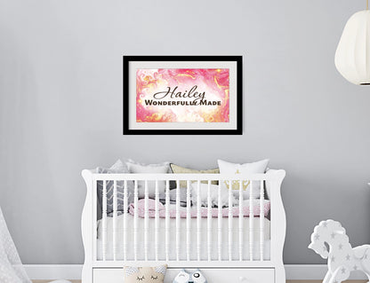 Personalized nursery room wall art printed with a white border, framed and displayed on a wall above a crib.