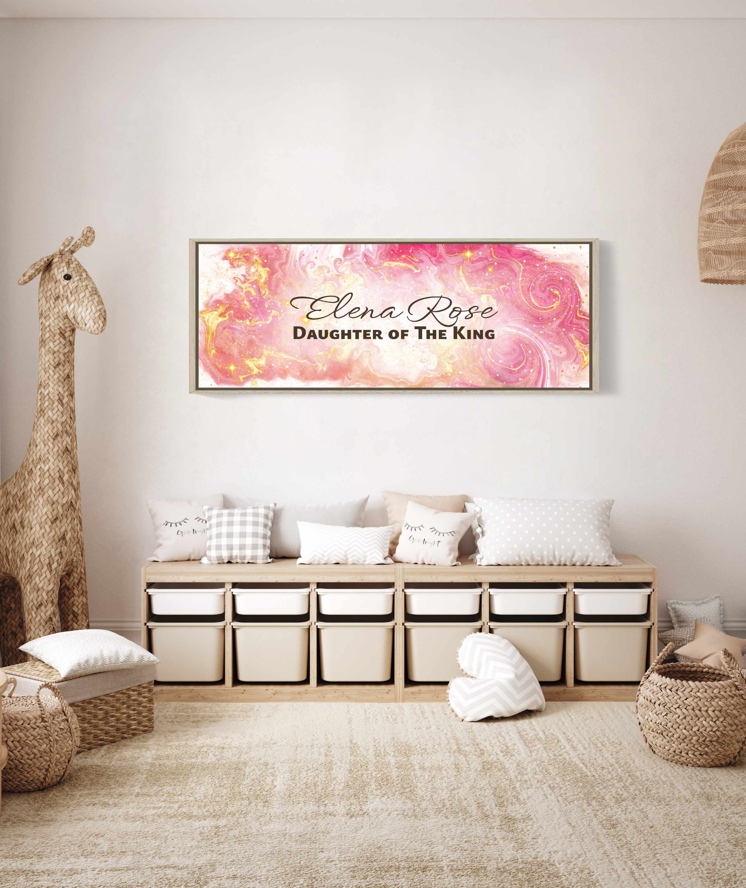 Framed, personalized wall art with 'Elena Rose Daughter of the King' text in a child's playroom above a wooden bench with decorative pillows and baskets