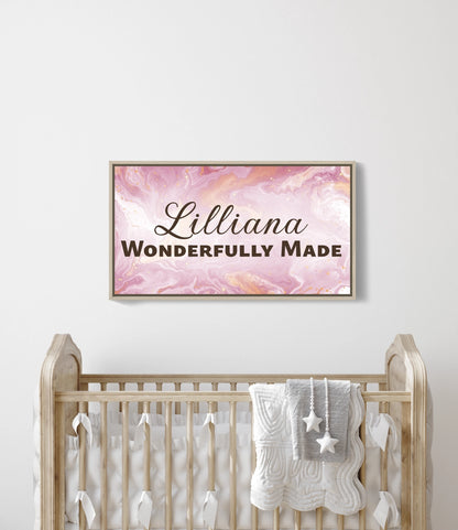 Personalized nursery room wall art printed on a framed, stretched canvas and displayed on a white wall.