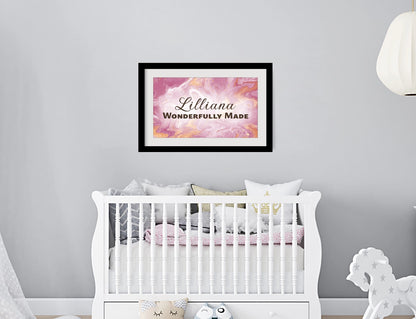 Personalized nursery room wall art printed with a white border, framed and displayed on a wall above a crib.
