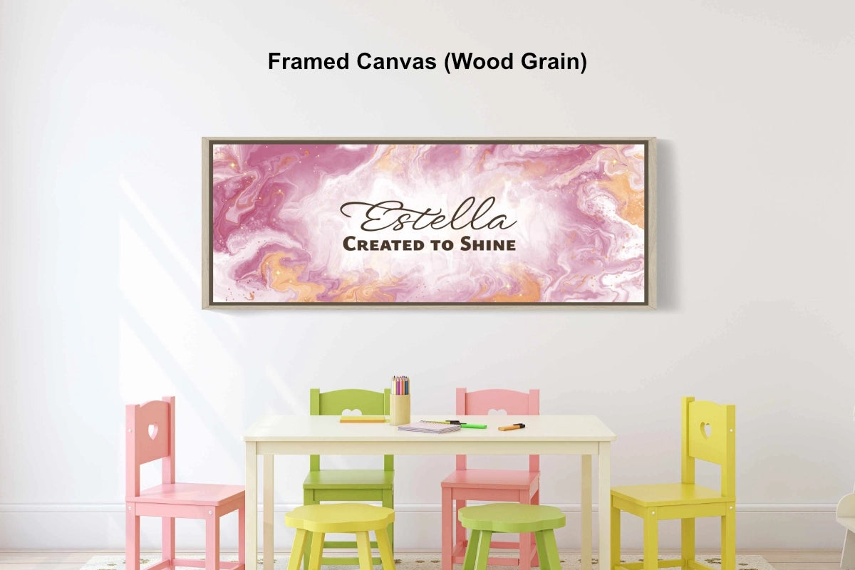 Personalized playroom wall art on a wall above a child’s table and chairs.