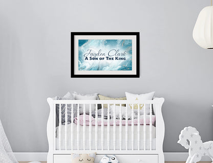 Personalized nursery room wall art printed with a white border, framed and displayed on a wall above a crib.