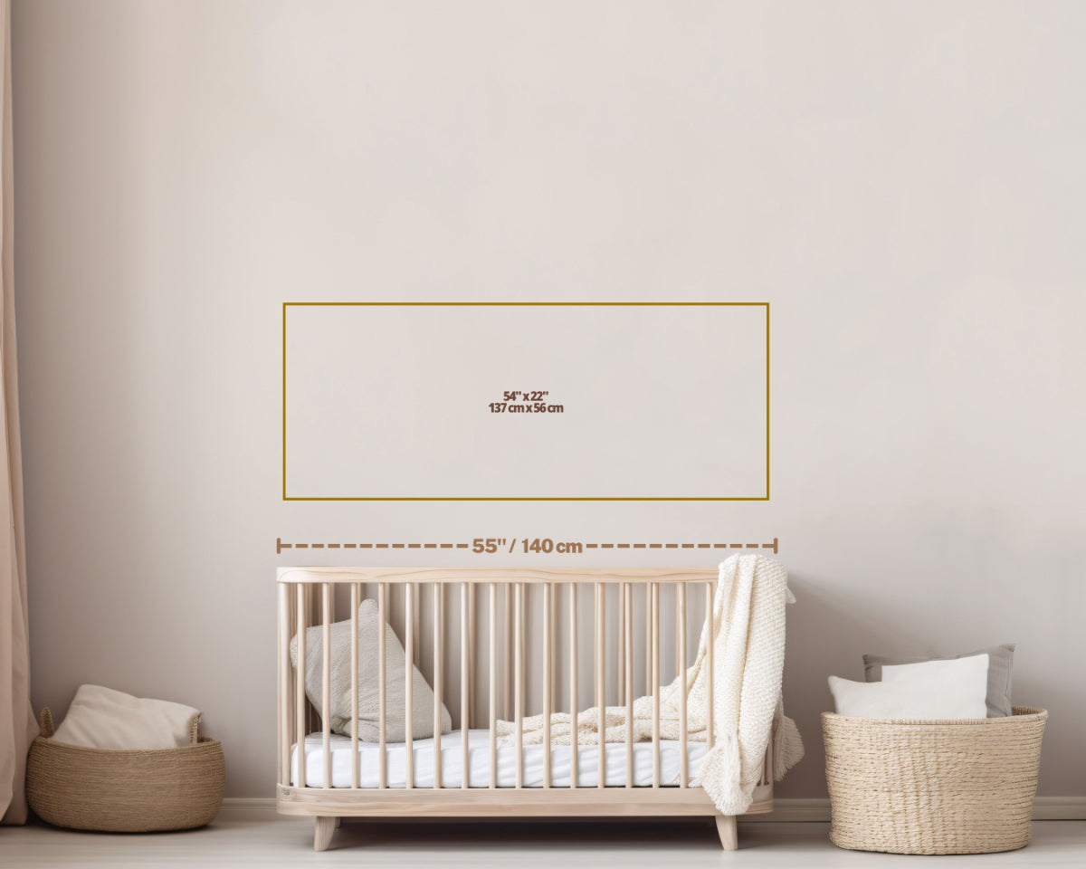 Wall art size guide on a nursery wall above a wooden crib